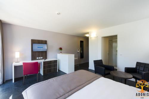 Letto o letti in una camera di Adonis Dijon Maison Internationale