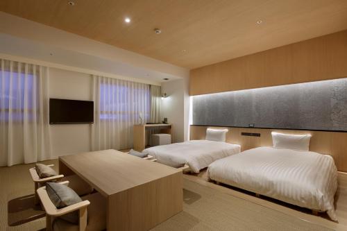 Postel nebo postele na pokoji v ubytování Lime Resort Myoko