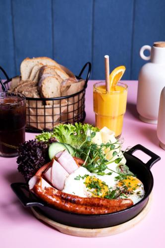 a plate of food on a table with bread at GRANO APARTMENTS Gdańsk Old Town SPA & Wellness - GRANO APARTMENTS Gdańsk Residence SPA & Wellness in Gdańsk
