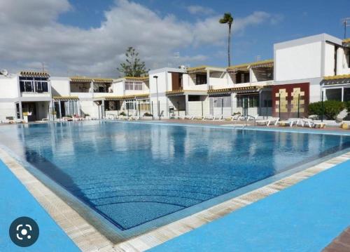 a large swimming pool in the middle of a resort at Costa del Silencio El Drago in Costa Del Silencio