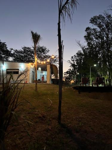 a building with lights in a park at night at Mirador del Río in Villa La Rivera