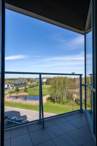 a view from the balcony of a house at Elija Swan-Toy Apartments in Šventoji