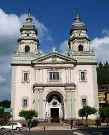 a white building with two towers on top of it at De la Cuenca Mieres II con parking Privado in Mieres