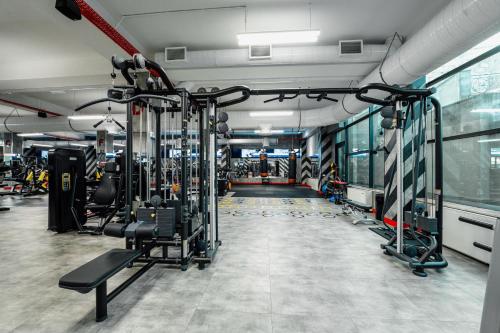 a gym with lots of equipment in a room at Hills Resort Hotel in Yerevan