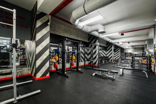 a gym with lots of equipment in a room at Hills Resort Hotel in Yerevan