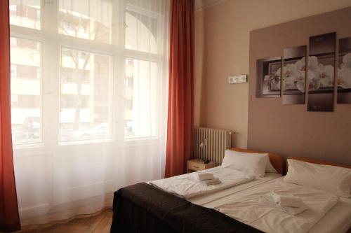 Katil atau katil-katil dalam bilik di Hotel Elegia am Kurfürstendamm