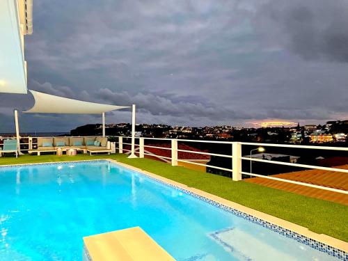 a swimming pool on the roof of a building at Villa Leoni Curaçao in Willemstad