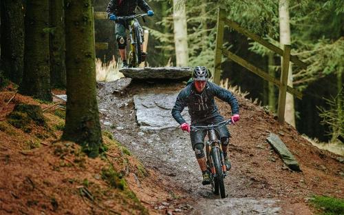 two people riding bikes on a dirt trail at Trevose in Wrexham