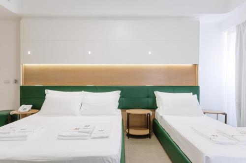 Letto o letti in una camera di M&F Hotel