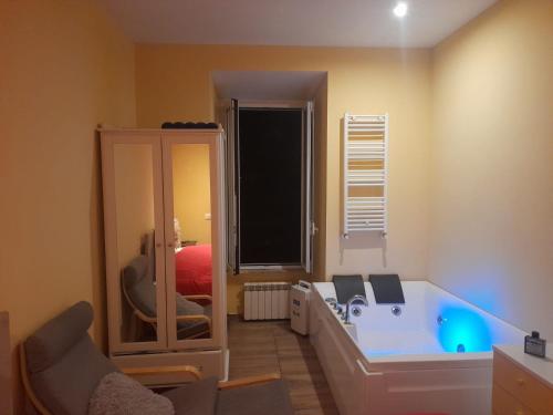 a bathroom with a tub and a chair in a room at Apt B.H rome (piazza bologna square ) in Rome
