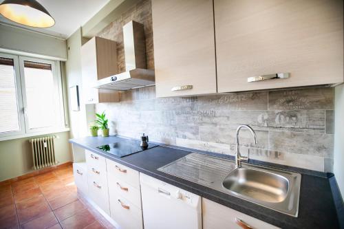 a kitchen with a sink and a counter top at Chic and Freak Atelier in Como