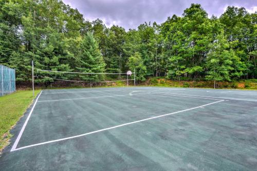 a tennis court with a net and a basketball hoop at Cozy Pennsylvania Home with Pool Table and Pool Access in Effort