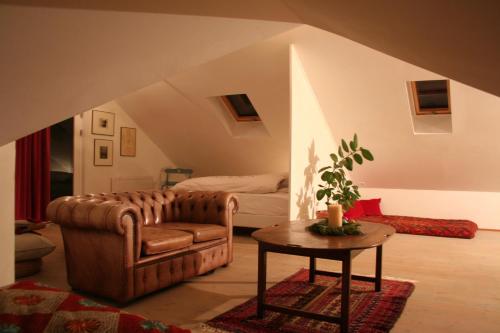 a living room with a couch and a table at By the Lighthouse in Vogar