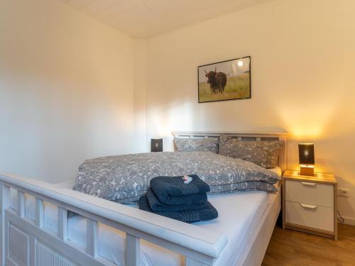 Ένα ή περισσότερα κρεβάτια σε δωμάτιο στο Ferienhaus mit Terrasse in St Peter-Ording