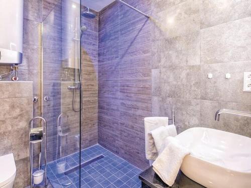 a bathroom with a shower and a sink and a tub at Charming apartment in Mijas in Mijas