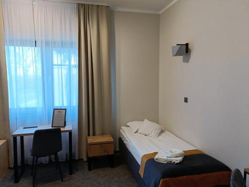 Postel nebo postele na pokoji v ubytování Leśne Niebo