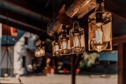 a group of glass lights hanging from a ceiling at Domki RADAWA na Kliszówce in Radawa