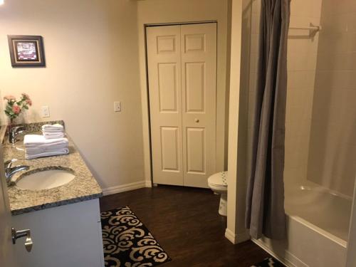 a bathroom with a sink and a toilet and a shower at 3 Bedrooms 2 Bathrooms Lucaya Village 22-103 in Orlando