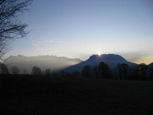 a view of the sun rising over a mountain at Haus Abendsonne in Reit im Winkl