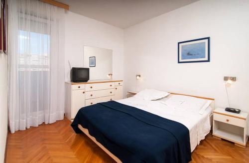 Postel nebo postele na pokoji v ubytování Apartment Definis