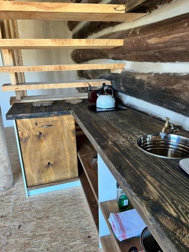 a kitchen with a wooden counter top with a sink at Villa Keys in Wilderness