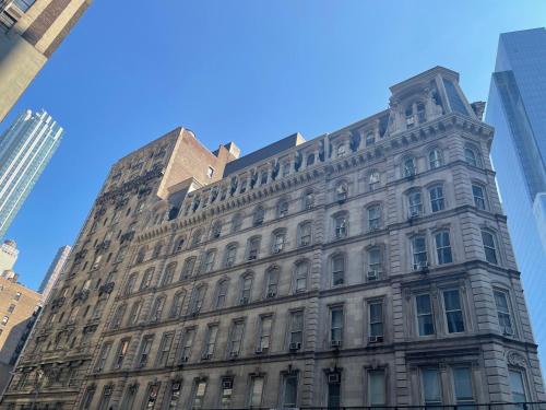 a building in the middle of the city at Hotel and the City, Rooftop City View in New York