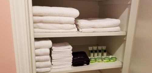 a towel rack with towels and other towels in a bathroom at Pine Haven Lake front home /w Dock in Murrayville