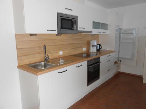 A cozinha ou cozinha compacta de Appartement beim Brunnen 10