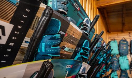 a row of skiis hanging on a wall at Lagon energy dakhla in Dakhla