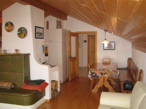 a living room with a couch and a table at Dachwohnung Unterem Hoereli in Vals