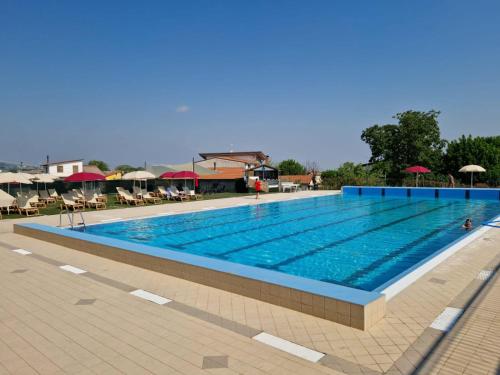 a large swimming pool with blue water at Al Campanaro b&b in Taurasi