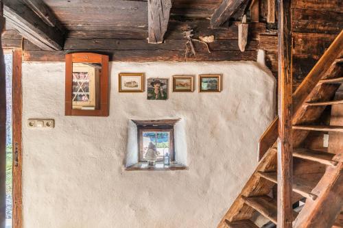 a room with a window in a wooden building at Stoffelhäusl in Reith im Alpbachtal