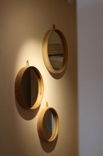 a wall with two mirrors on a wall at Lagon energy dakhla in Dakhla
