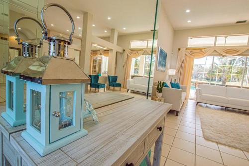 a large living room with a kitchen with a stove at Fairway Haven in Wesley Chapel