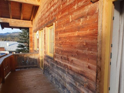 a wooden wall on the side of a house at Ski apartment St. Johann in Tirol, Kitzbuheler Alpen in Sankt Johann in Tirol