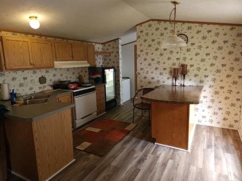 a kitchen with a island in the middle of it at Sharon's Run Cozy 3 bedroom/2 bath 