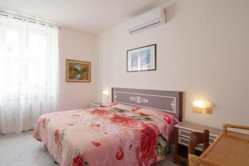 Ένα ή περισσότερα κρεβάτια σε δωμάτιο στο Lentisco Centro - HelloElba
