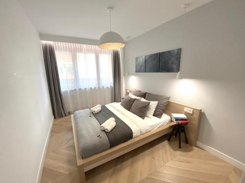 Posteľ alebo postele v izbe v ubytovaní MyCherry - Old Town Apartment - Więzienna 21C