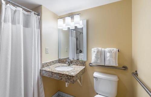 a bathroom with a toilet and a sink and a shower at Extended Stay America Suites - Norfolk - Virginia Beach in Virginia Beach