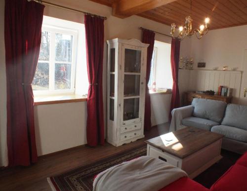 a living room with a couch and a window at Ferienhaus in Unken mit Großer Terrasse in Unken