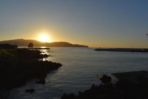 a sunset over a large body of water at Villa Da Madalena in Madalena
