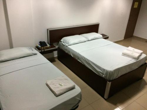 Un pat sau paturi într-o cameră la Residencial Turístico El Descanso