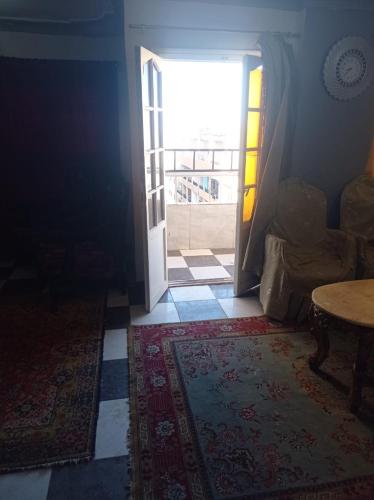 an open door to a room with a table at خالد بن الوليد بجوار كشرى التحرير in Alexandria