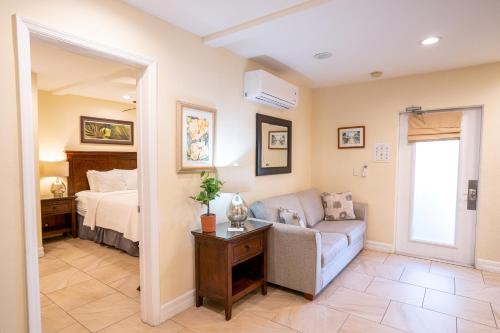 a living room with a couch and a bed at The Capri at Siesta in Siesta Key