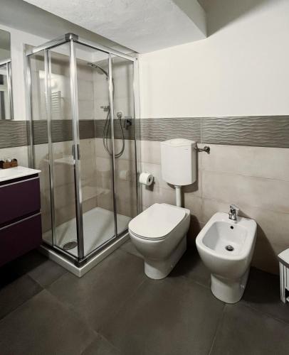 a bathroom with a shower and a toilet and a sink at Da Mario in Florence Guesthouse in Florence