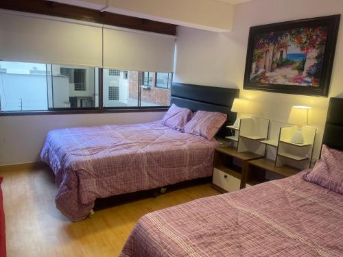 Ένα ή περισσότερα κρεβάτια σε δωμάτιο στο 17 Dpto con inmejorable ubicación Miraflores