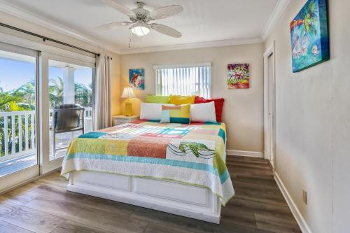 a bedroom with a bed and a balcony at Sunset Villas 3 in Clearwater Beach