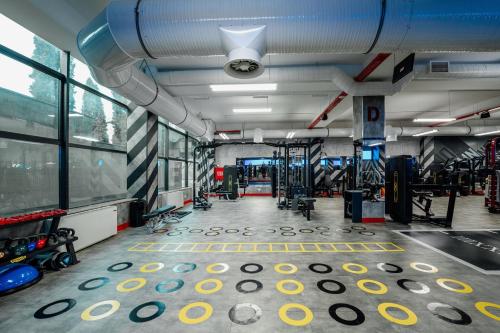 a gym with a lot of equipment in a room at Hills Resort Hotel in Yerevan