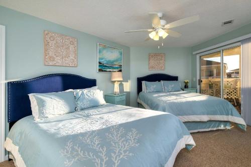 a bedroom with two beds and a ceiling fan at Less Than 1 Mi to Ocean North Myrtle Beach Condo in Myrtle Beach