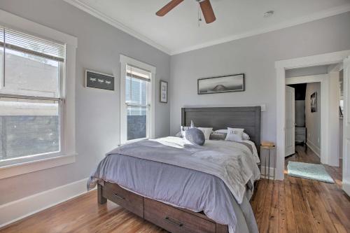 a bedroom with a bed and a ceiling fan at Cozy Beach Bungalow Near Galveston Seawall and Pier in Galveston